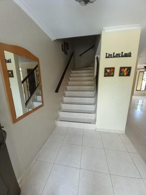 Spacious living dining area with ceramic tile floors and terrace access in Albrook family house