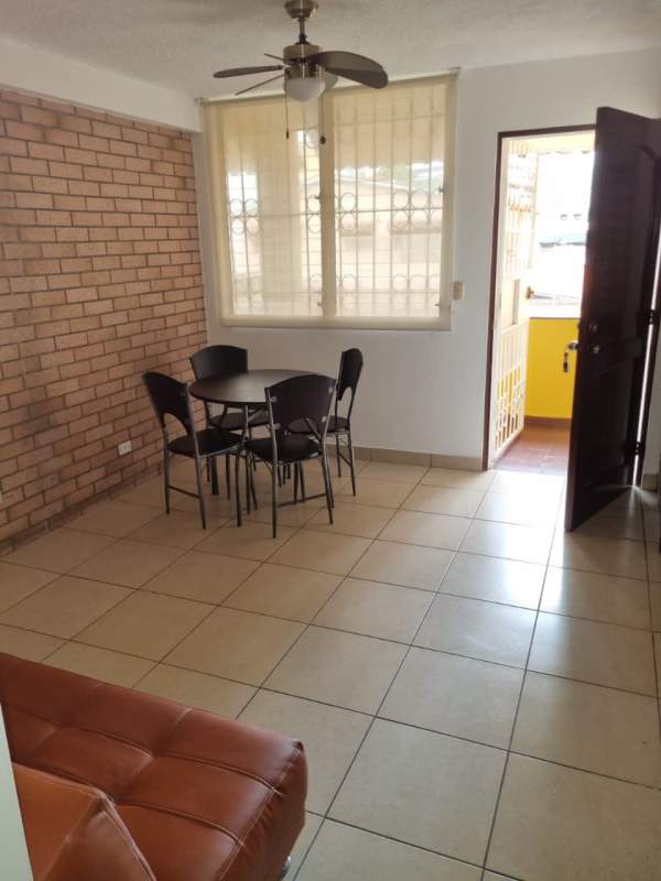 Compact kitchen with granite countertop, gas stove and refrigerator PH Colonial San Francisco Panama