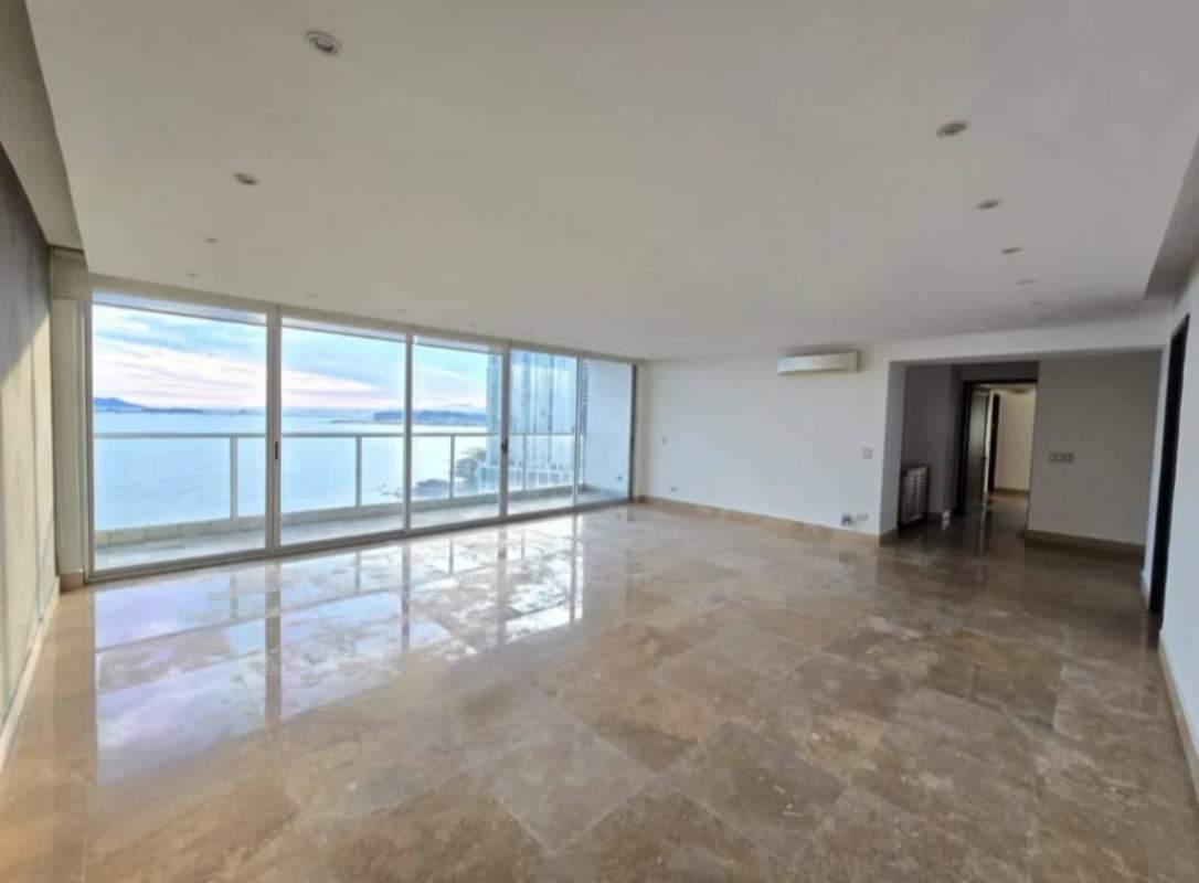 Modern open-space living-dining room with oceanfront view in luxury PH Q Tower Punta Pacífica Panama