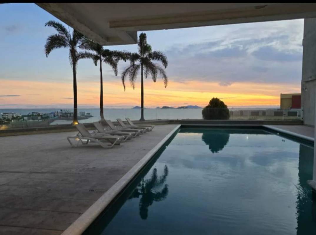 Large infinity swimming pool overlooking Pacific Ocean at PH Q Tower in Punta Pacífica Panama City