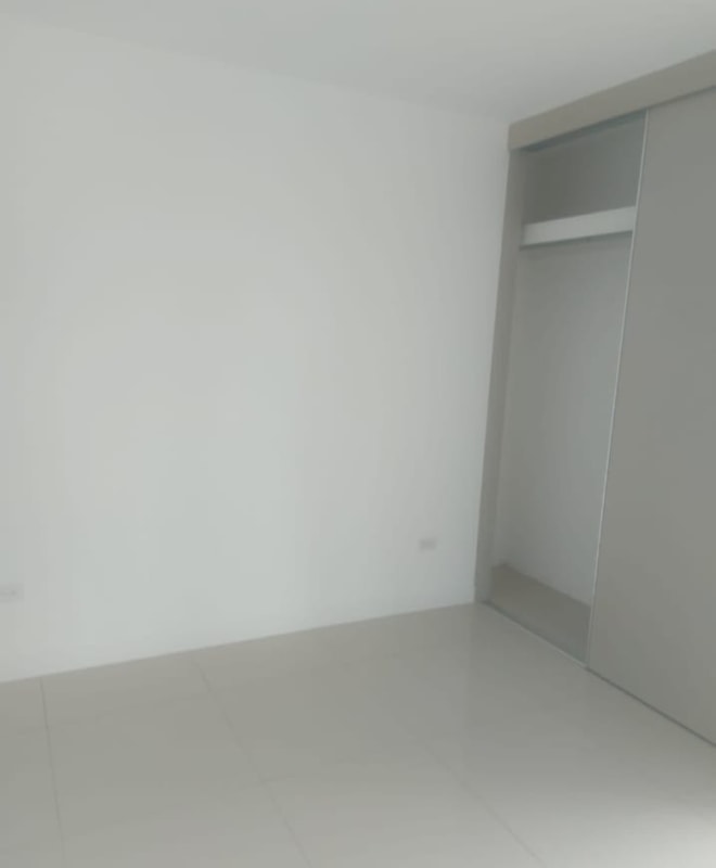 Bedroom with ceramic floor and built-in closet at PH Coral Plaza Betania