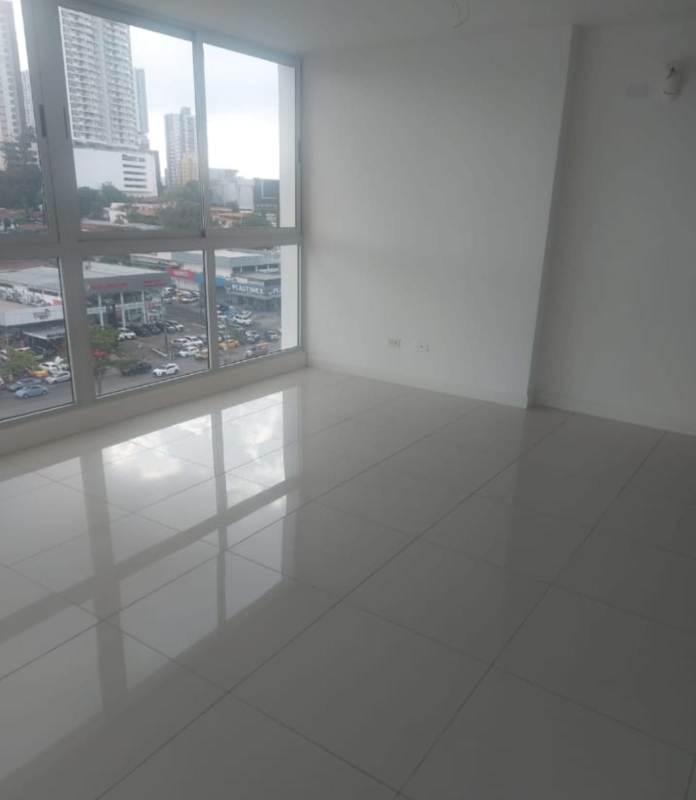 Spacious living-dining area with large windows and city views PH Coral Plaza