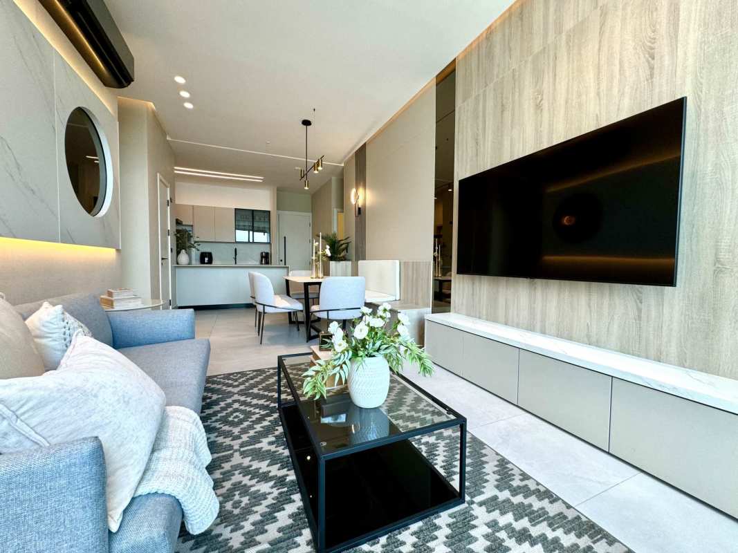 Modern open kitchen with marble island, premium finishes in PH Aquapoint Punta Paitilla Panama City