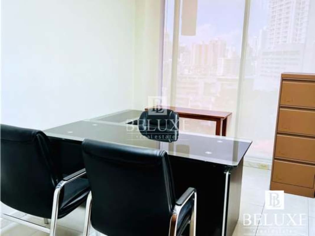 Office with glass windows overlooking Obarrio Panama City skyline PH Omega