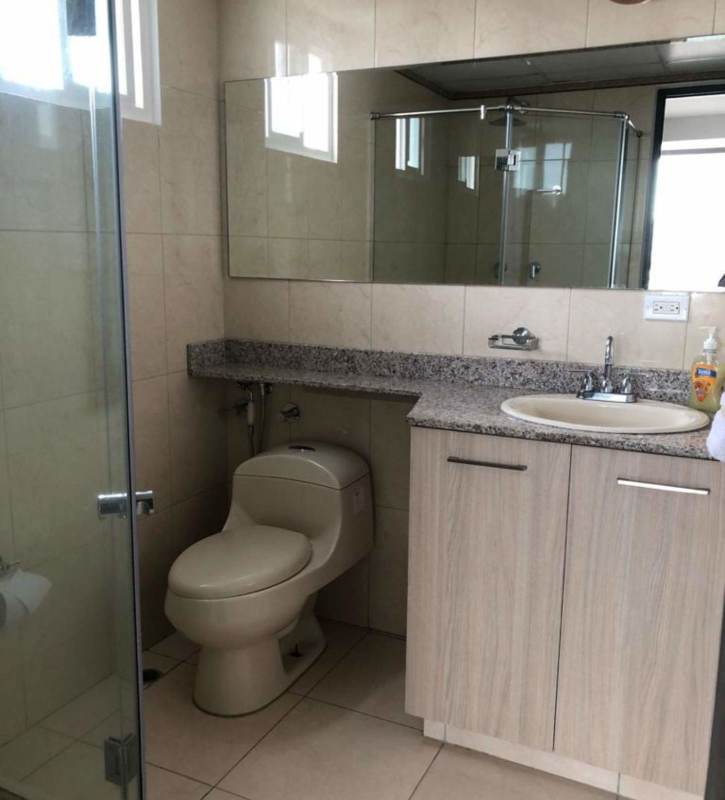 Modern bathroom with granite top, glass shower door PH Hato Tower Hato Pintado