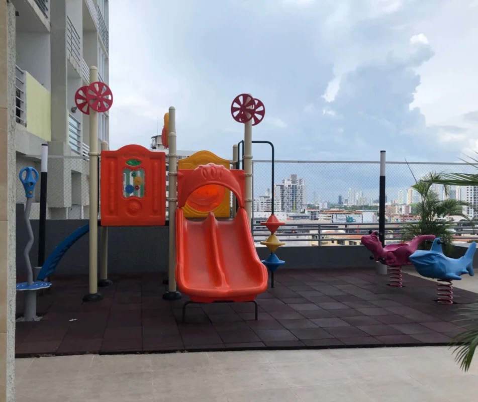 Secure rooftop playground with slides and skyline view PH Hato Tower