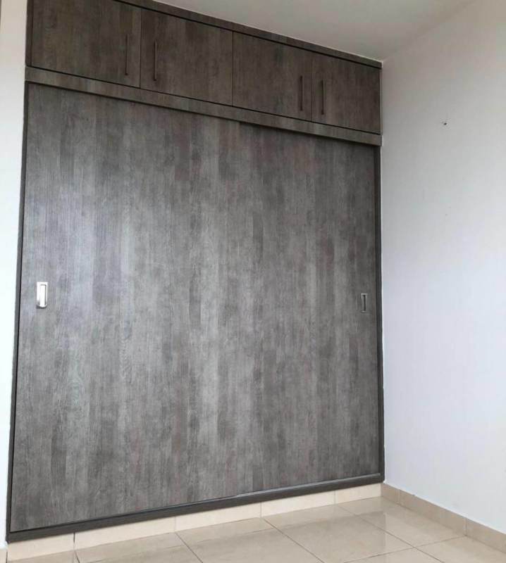 Bedroom closet with sliding doors and storage in Hato Tower Condo Panama