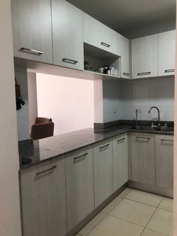 Modern kitchen granite counters ample cabinetry pass-through PH Hato Tower Panama