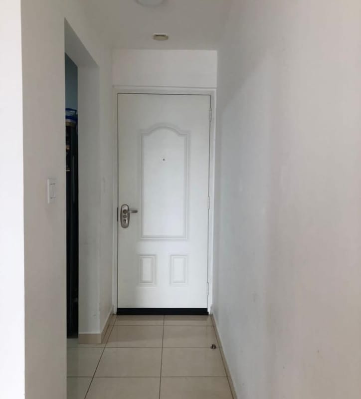 Minimalist entrance hallway with white door and tile floor PH Hato Tower Hato Pintado Panama