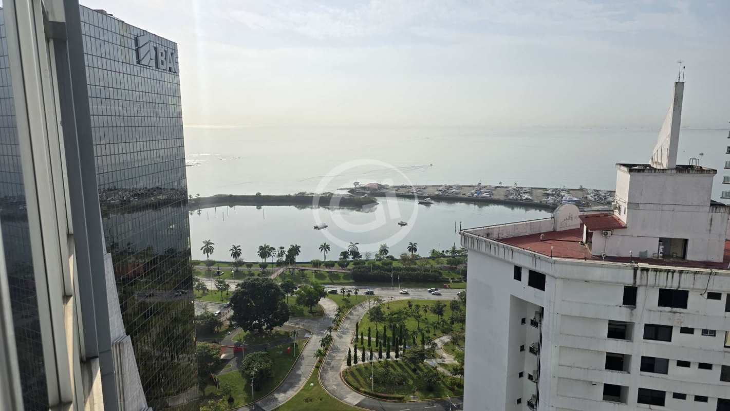 Luxurious infinity pool with skyline and ocean views at amenity level Colores de Bella Vista