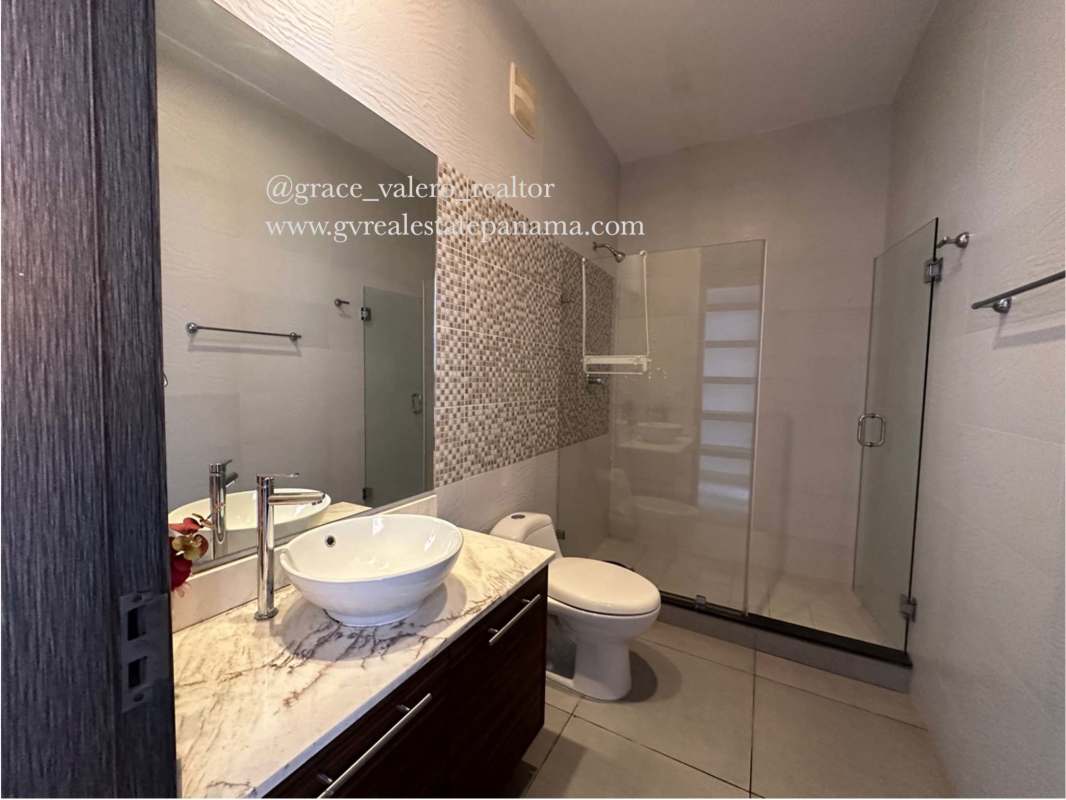 Modern bath with marble countertop, vessel sink, glass walk-in shower PH Element Panama