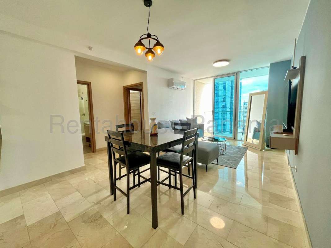 Modern kitchen with wood cabinetry, granite counters, quality appliances at Dynasty Residences Bella Vista Panama