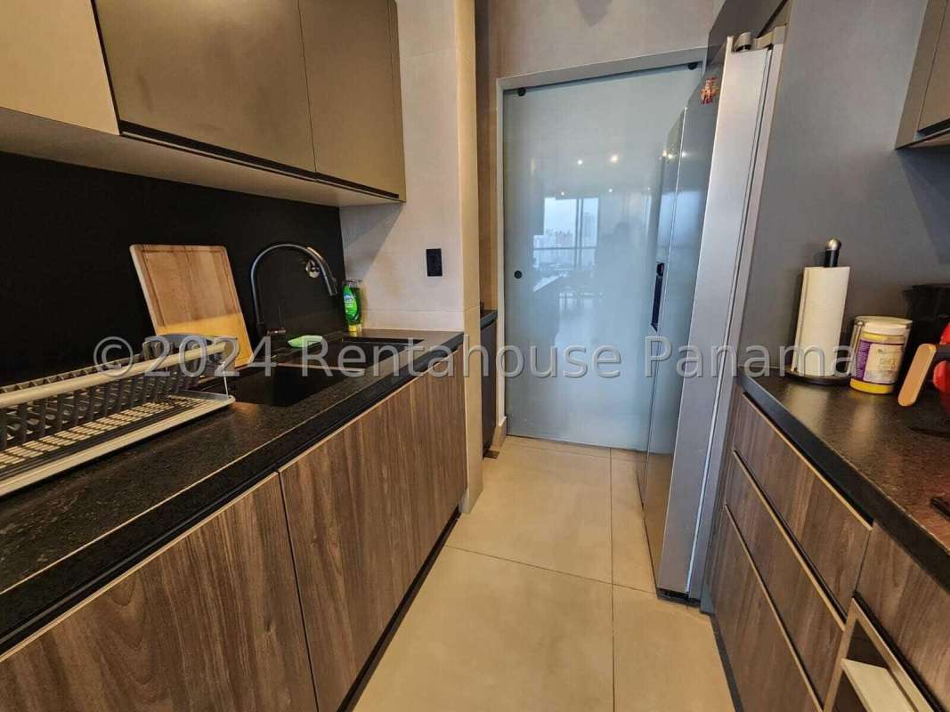 Sleek kitchen with granite countertops and modern cabinetry in PH Victory Sport, Coco del Mar