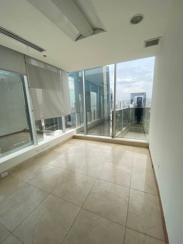 Office room with floor-to-ceiling windows and skyline view Bella Vista Tower Panama City