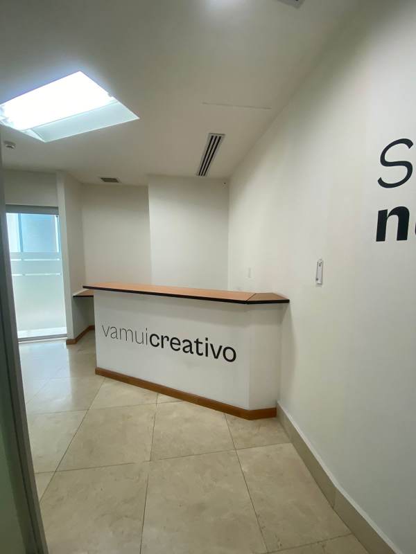 Modern office partitioned with glass walls and tile flooring in Panama City