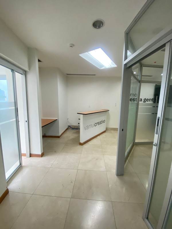 High-rise apartment balcony with glass railing overlooking Panama City skyline Bella Vista