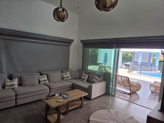 Outdoor pool with jacuzzi surrounded by tropical garden Punta Barco Village luxury rental