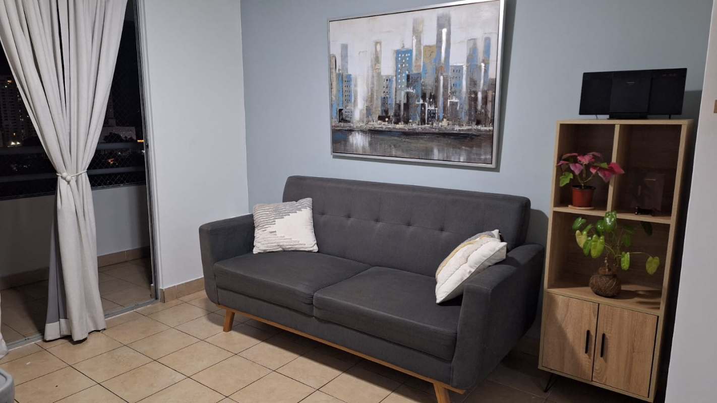 Furnished living room with large sliding door to balcony in PH Lefevre 75 Parque Lefevre Panama