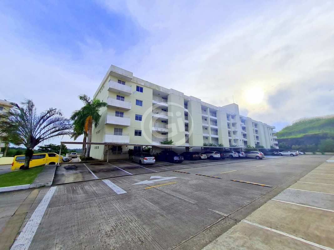 Modern apartment building complex Altamira Gardens surrounded by greenery in Panama City