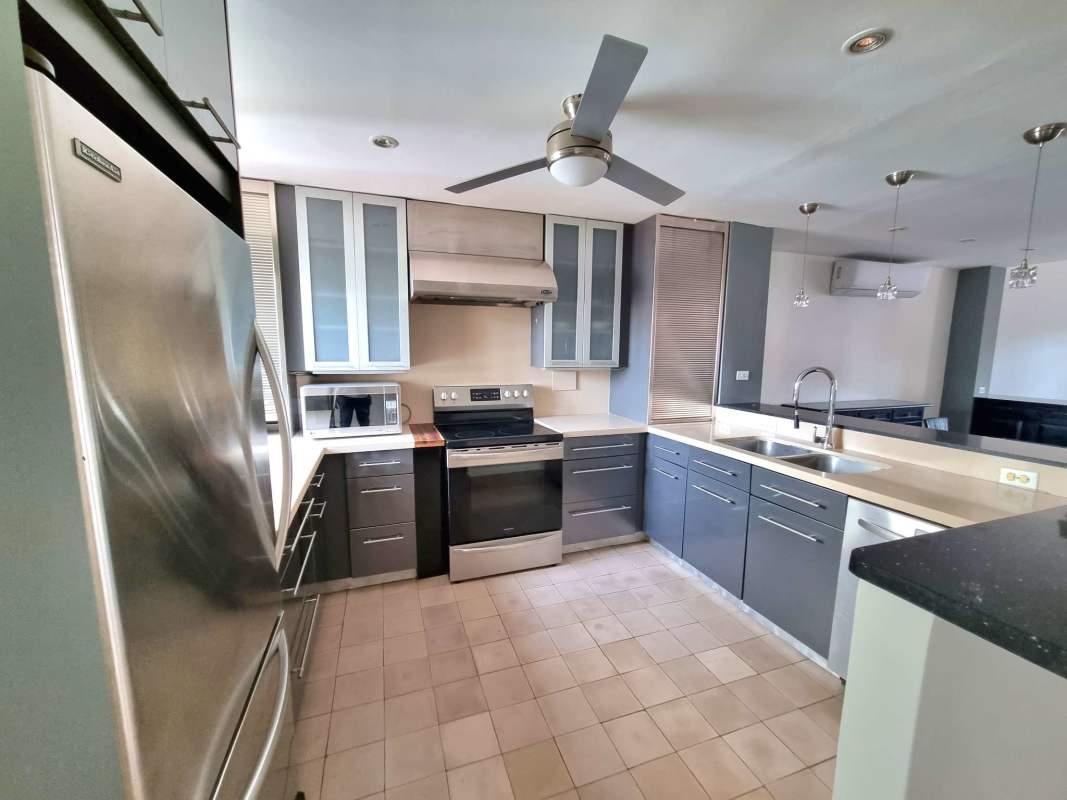 Spacious primary bedroom with balcony access, ensuite bathroom, and colonial charm in Casco Viejo rental