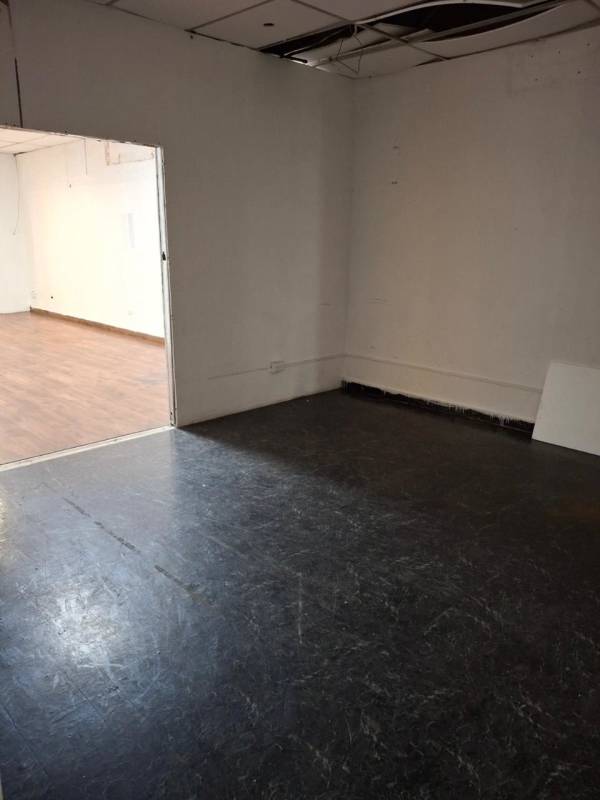 Connected interior rooms with vinyl flooring and drop ceiling PH Plaza Via España