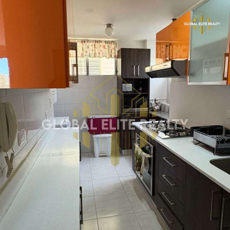Kitchen with appliances and upper cabinets in PH Condado Country Club Condado del Rey Panama City