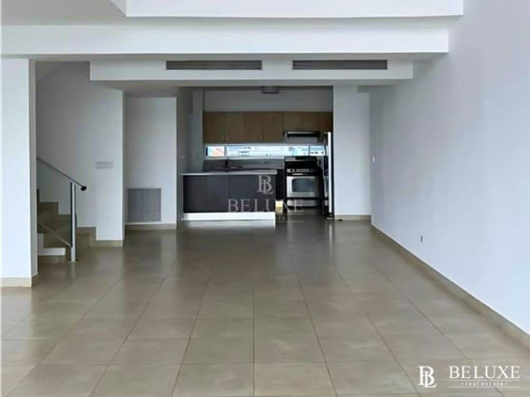 Open loft-style duplex living room with large balcony in PH H2O Panama City