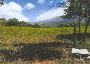 Rolling hills with grassy terrain and distant mountains on vacant land for sale Santa Fe Panama