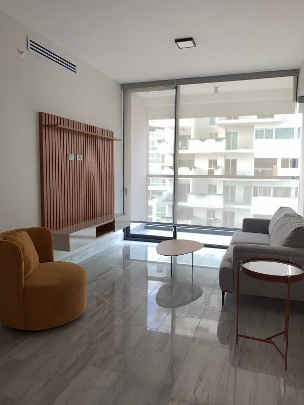 Minimalist living room with glass doors, panoramic view, sofa in PH Nuovo Armani Casa Avenida Balboa Panama City
