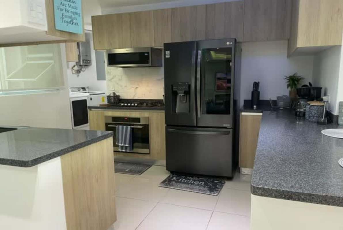 Modern granite countertop kitchen in PH Albrook Point Clayton Panama with full appliances