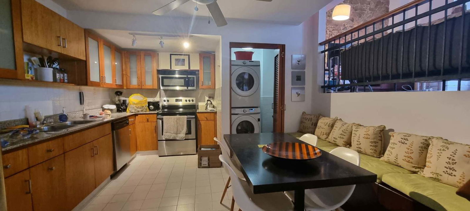 Restored colonial balcony with iron railings overlooking Casco Viejo historic streets and skyline