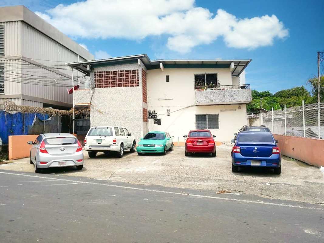 Two story building with gravel parking lot Carrasquilla close to Via España and Parque Omar Panama City