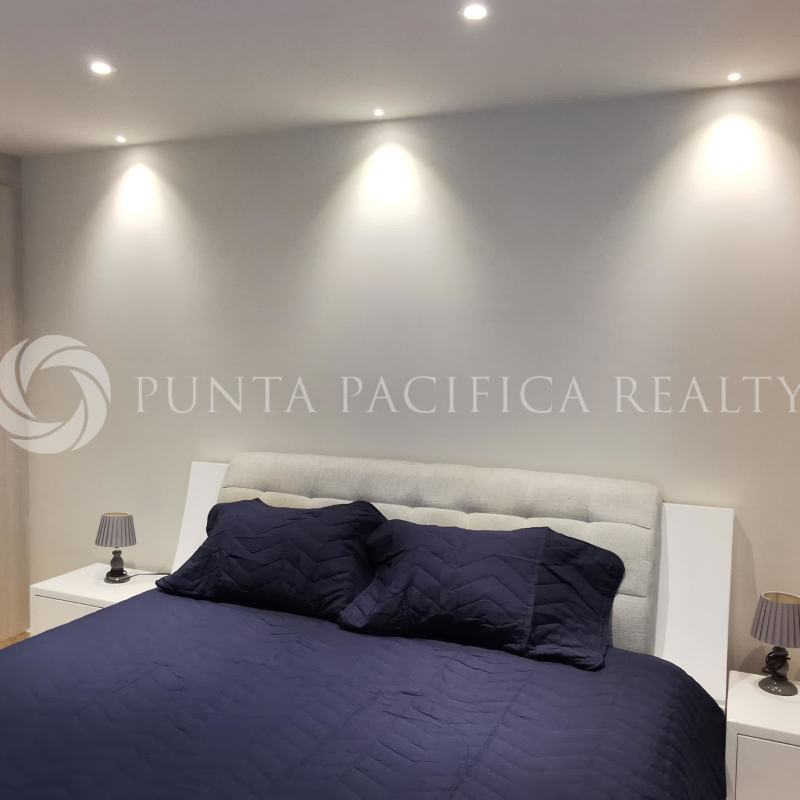 Bedroom with marble floors, large windows, and city views in PH The Regent Panama City