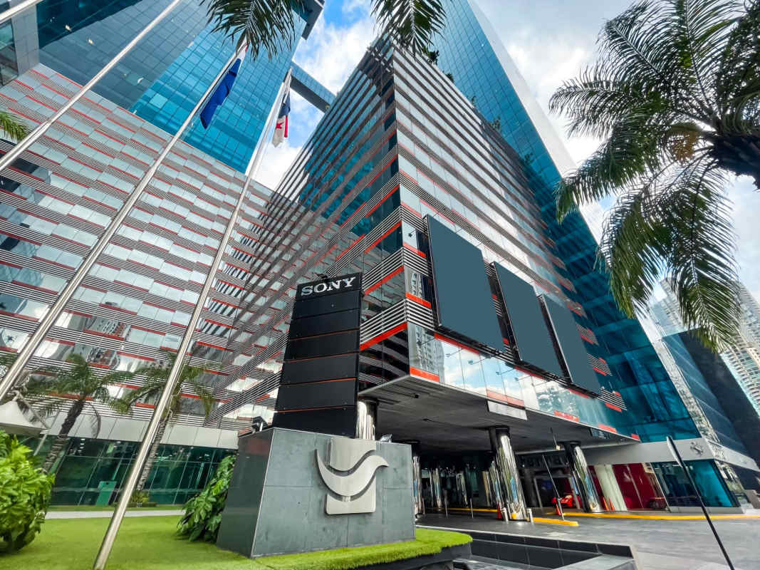 Modern elevator lobby with high gloss floors and multiple elevators at Oceanía Business Plaza Panama City