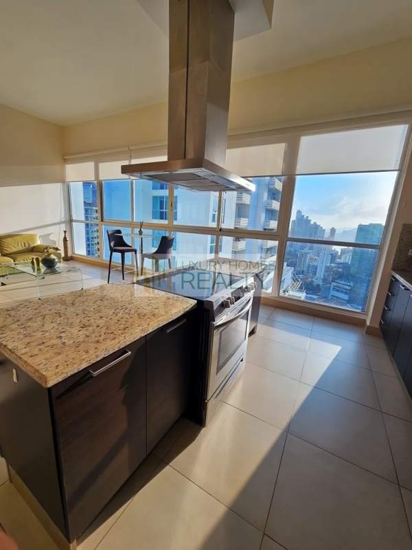 Contemporary kitchen with granite counters and stainless appliances, ocean view in PH Oceanaire Panama.