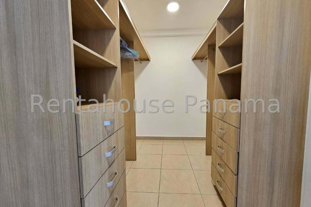 Contemporary kitchen with wooden cabinets and breakfast bar in luxury apartment PH Ocean Club Punta Pacifica Panama