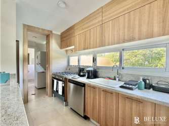 Modern kitchen with dining area open layout in PH Bahia beachfront apartment Panama