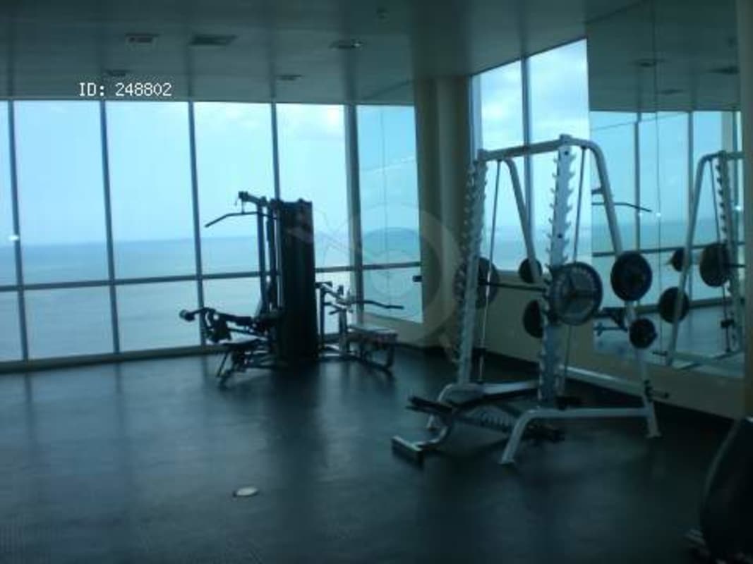 Balcony view with Pacific Ocean, coastal road and Panama City skyline from PH H2O