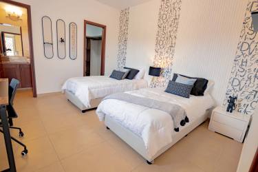 Open kitchen with granite countertops and hardwood cabinets at Tucan Country Club Villa Panama