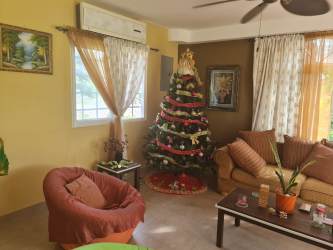 Kitchen with marble countertop and wood cabinetry rental house San Carlos Panama