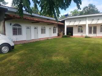 Bedroom with private bath and patio access in rental home El Valle Village Panama