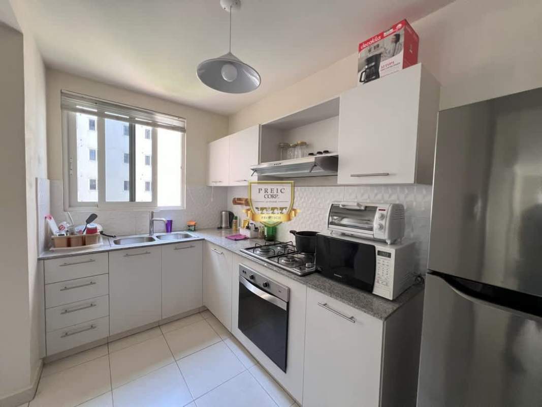 Bright kitchen in PH Versalles Panama with granite countertops, appliances and large window Las Acacias