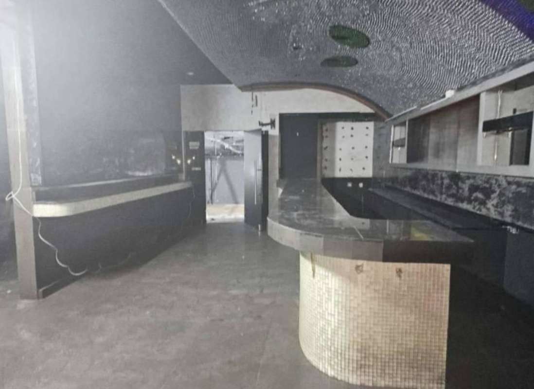 Minimalist commercial hallway with tiled floors, decorative walls, metal railing Marbella Panama