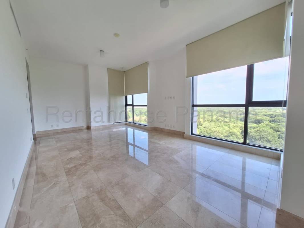 Bright spacious living area with natural light and marble floors in Santa Maria Panama apartment