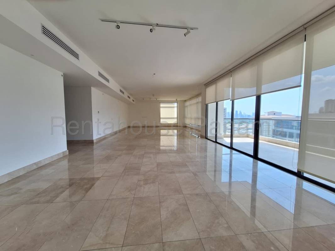 Elegant marble bathroom with double sink, glass-enclosed shower in luxury apartment PH The Reserve Panama