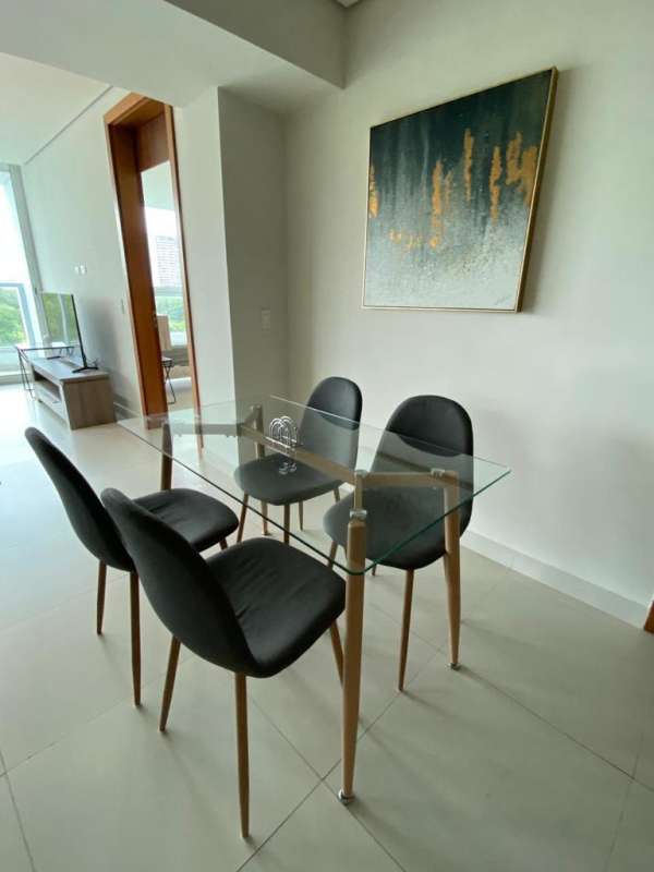 Furnished dining and living area with natural light, Costa del Este highrise apartment