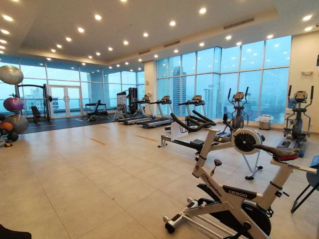 Laundry room with washer, dryer and storage in PH Parkside Costa del Este apartment