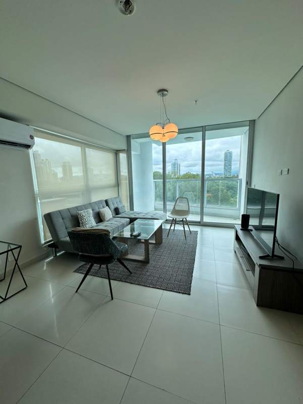 Laundry room with washer, dryer and storage shelves in apartment at Costa del Este