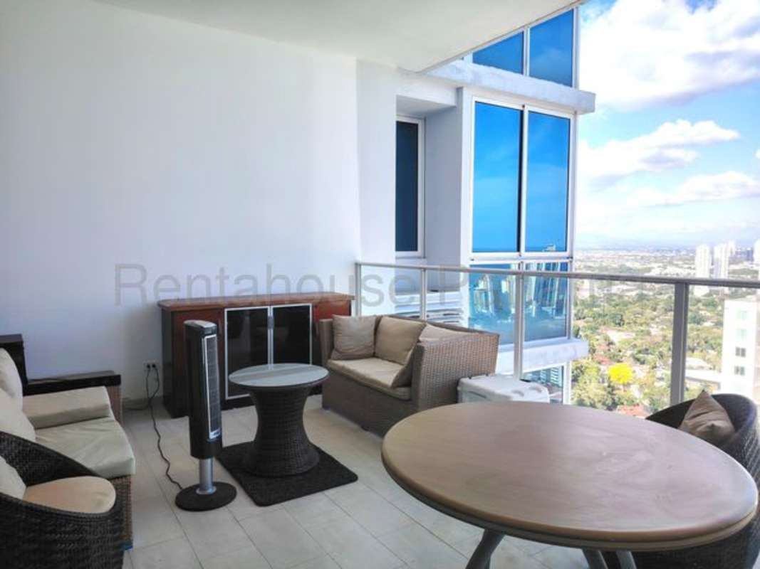 Spacious bedroom with ocean and city view, floor-to-ceiling windows, and modern furnishings in PH Quadrat