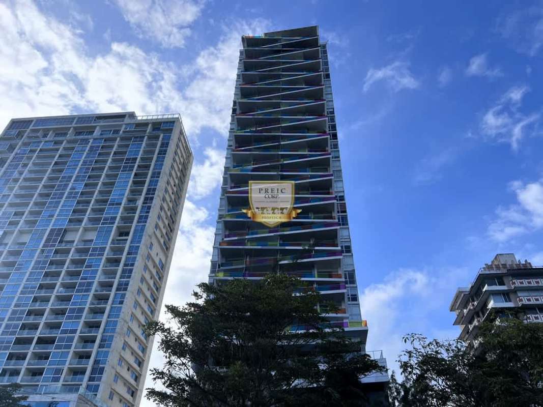 Modern living area opens to balcony with ocean views in PH Element Tower Panama City